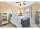 Charming bedroom with blue accents, tile flooring, and a bright window at 4386 Library St, Port Charlotte, FL 33948