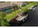 Aerial view of a backyard boat dock featuring a boat lift on the canal at 4386 Library St, Port Charlotte, FL 33948