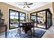 Bright dining area leading to the screened pool deck, offering a great view and ample natural light at 4386 Library St, Port Charlotte, FL 33948