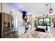 Well-appointed kitchen with stainless steel appliances, custom cabinetry, and modern lighting at 4386 Library St, Port Charlotte, FL 33948