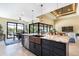 Spacious kitchen island with granite countertop, copper sink, and stainless-steel appliances with an open floorplan at 4386 Library St, Port Charlotte, FL 33948