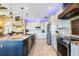 Modern kitchen with a large center island, stainless steel appliances, and custom lighting at 4386 Library St, Port Charlotte, FL 33948