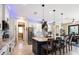 Gourmet kitchen featuring a large island, custom lighting, and stainless-steel appliances at 4386 Library St, Port Charlotte, FL 33948
