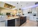 Gourmet kitchen featuring a large center island, open layout, and stainless steel appliances at 4386 Library St, Port Charlotte, FL 33948