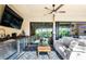 Comfortable covered lanai features a flatscreen television, wet bar, mini refrigerator and a comfortable seating area and interior views at 4386 Library St, Port Charlotte, FL 33948