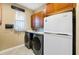 Convenient laundry room with ample cabinetry, a laundry sink, and newer washer and dryer units at 4386 Library St, Port Charlotte, FL 33948
