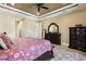 A large main bedroom with neutral decor, a walk-in closet and entry door at 4386 Library St, Port Charlotte, FL 33948