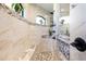 The bathroom shower features stone accents, built-in bench seating, and arched windows at 4386 Library St, Port Charlotte, FL 33948