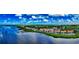 Breathtaking aerial view of the beachfront condos with picturesque waterways along a coastal setting in Florida at 4535 Bay Club Dr, Bradenton, FL 34210