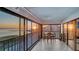 A spacious, screened balcony provides an excellent view of the sunset over the ocean at 4535 Bay Club Dr, Bradenton, FL 34210