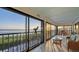 Spacious screened in balcony with telescope and seating area overlooking the ocean at 4535 Bay Club Dr, Bradenton, FL 34210