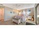 Charming bedroom with a king bed, ensuite lanai, and beautiful decorations at 4535 Bay Club Dr, Bradenton, FL 34210