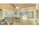 Bright dining room boasts vaulted ceilings, a chandelier, and tile flooring at 4535 Bay Club Dr, Bradenton, FL 34210