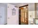 Indoor elevator with wood slats and a black folding gate at 4535 Bay Club Dr, Bradenton, FL 34210