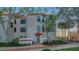 Attractive three-story condo with a red tile roof and well-maintained landscaping at 4535 Bay Club Dr, Bradenton, FL 34210