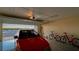 Garage with car and bikes parked inside with epoxy floors at 4535 Bay Club Dr, Bradenton, FL 34210