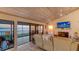 Living area showing water views, fireplace, tv, and comfortable furniture at 4535 Bay Club Dr, Bradenton, FL 34210