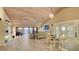 Spacious living room with high wood ceilings, tile floors, and a view of the water at 4535 Bay Club Dr, Bradenton, FL 34210