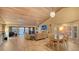 Bright living room with tile floors, vaulted ceilings, fireplace, and beautiful water views at 4535 Bay Club Dr, Bradenton, FL 34210