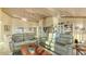 Open living area with tile floors, comfortable seating, and easy access to the kitchen at 4535 Bay Club Dr, Bradenton, FL 34210