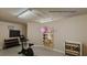 Staged storage room with exercise equipment and wine fridge at 4535 Bay Club Dr, Bradenton, FL 34210