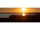 Stunning sunset view over tranquil waters, showcasing the natural beauty of the waterfront property at 4535 Bay Club Dr, Bradenton, FL 34210
