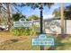 Welcoming sign for Jefferson Club with address marker under beautiful trees on a well-manicured lawn at 500 N Jefferson Ave # B2, Sarasota, FL 34237