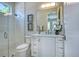 Beautiful bathroom featuring a glass shower, white cabinets, and decorative artwork for a spa-like experience at 5103 Windward Ave, Sarasota, FL 34242