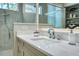 Close up of bathroom featuring a modern faucet, white countertop, and shower at 5103 Windward Ave, Sarasota, FL 34242