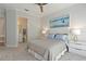 Serene bedroom with plush carpet, comfortable queen-sized bed and access to a bathroom at 5103 Windward Ave, Sarasota, FL 34242