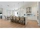 Bright, airy kitchen featuring a waterfall island with seating and modern, stainless steel appliances at 5103 Windward Ave, Sarasota, FL 34242
