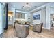 Cozy seating area with a wet bar, display cabinets and a TV for relaxation and entertainment at 5103 Windward Ave, Sarasota, FL 34242