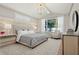 Calming main bedroom suite with soft colors, natural light, and luxurious furnishings at 5103 Windward Ave, Sarasota, FL 34242