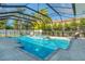 Inviting screened-in pool with spa and spacious deck area, perfect for outdoor relaxation at 5103 Windward Ave, Sarasota, FL 34242