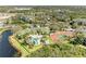 A panoramic view showing the community pool, tennis courts, lake and the green tile roofs; perfect for an active lifestyle at 5160 Northridge Rd # 302, Sarasota, FL 34238