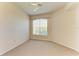 Bedroom with neutral carpet and neutral paint and ceiling fan at 5160 Northridge Rd # 302, Sarasota, FL 34238