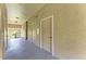 Hallway of building with door to unit visible in alcove at 5160 Northridge Rd # 302, Sarasota, FL 34238