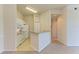 Well-lit kitchen featuring white appliances, plenty of counter space, and a breakfast bar at 5160 Northridge Rd # 302, Sarasota, FL 34238