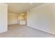 Bright living room with neutral carpet, connecting to a well-equipped kitchen at 5160 Northridge Rd # 302, Sarasota, FL 34238