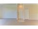 Spacious condo living room featuring neutral carpeting and a front door with tiled foyer at 5160 Northridge Rd # 302, Sarasota, FL 34238