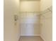 Walk-in closet with wire shelves to maximize storage at 5160 Northridge Rd # 302, Sarasota, FL 34238