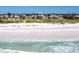 Breathtaking aerial view of the home's beach frontage and prime location, with ocean views at 534 Beach Rd, Sarasota, FL 34242