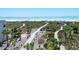 Picturesque beach access with winding paths through lush dune vegetation, leading to pristine white sands and turquoise waters at 534 Beach Rd, Sarasota, FL 34242