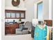 This primary bedroom includes a beverage center and sitting area with ocean views at 534 Beach Rd, Sarasota, FL 34242