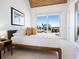Bright bedroom boasts wood ceiling, a large picture window, and luxury vinyl plank floors at 534 Beach Rd, Sarasota, FL 34242