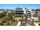 Beautiful home exterior showcasing multiple balconies, lush landscaping, and a coastal aesthetic at 534 Beach Rd, Sarasota, FL 34242