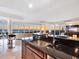 Modern kitchen with a sink, dark granite counters, and an ocean sunset view at 534 Beach Rd, Sarasota, FL 34242