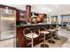 Sleek kitchen featuring a breakfast bar, modern appliances, and open views of the living space and ocean at 534 Beach Rd, Sarasota, FL 34242