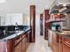 Well-appointed kitchen features granite countertops, wood cabinets, and modern fixtures at 534 Beach Rd, Sarasota, FL 34242