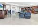 Modern living room with ocean views, an elevator, and adjacent gourmet kitchen at 534 Beach Rd, Sarasota, FL 34242
